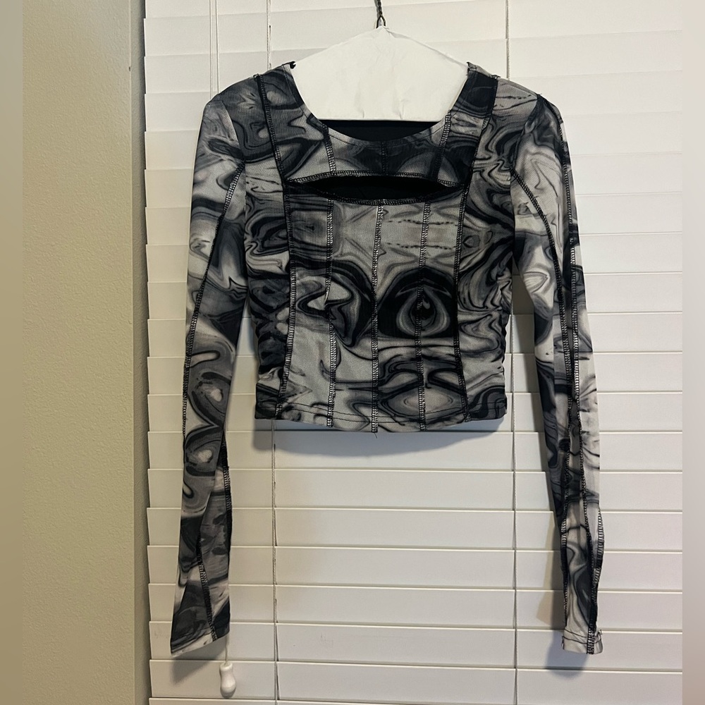 Crop top to go out. Has a little slit at the top.